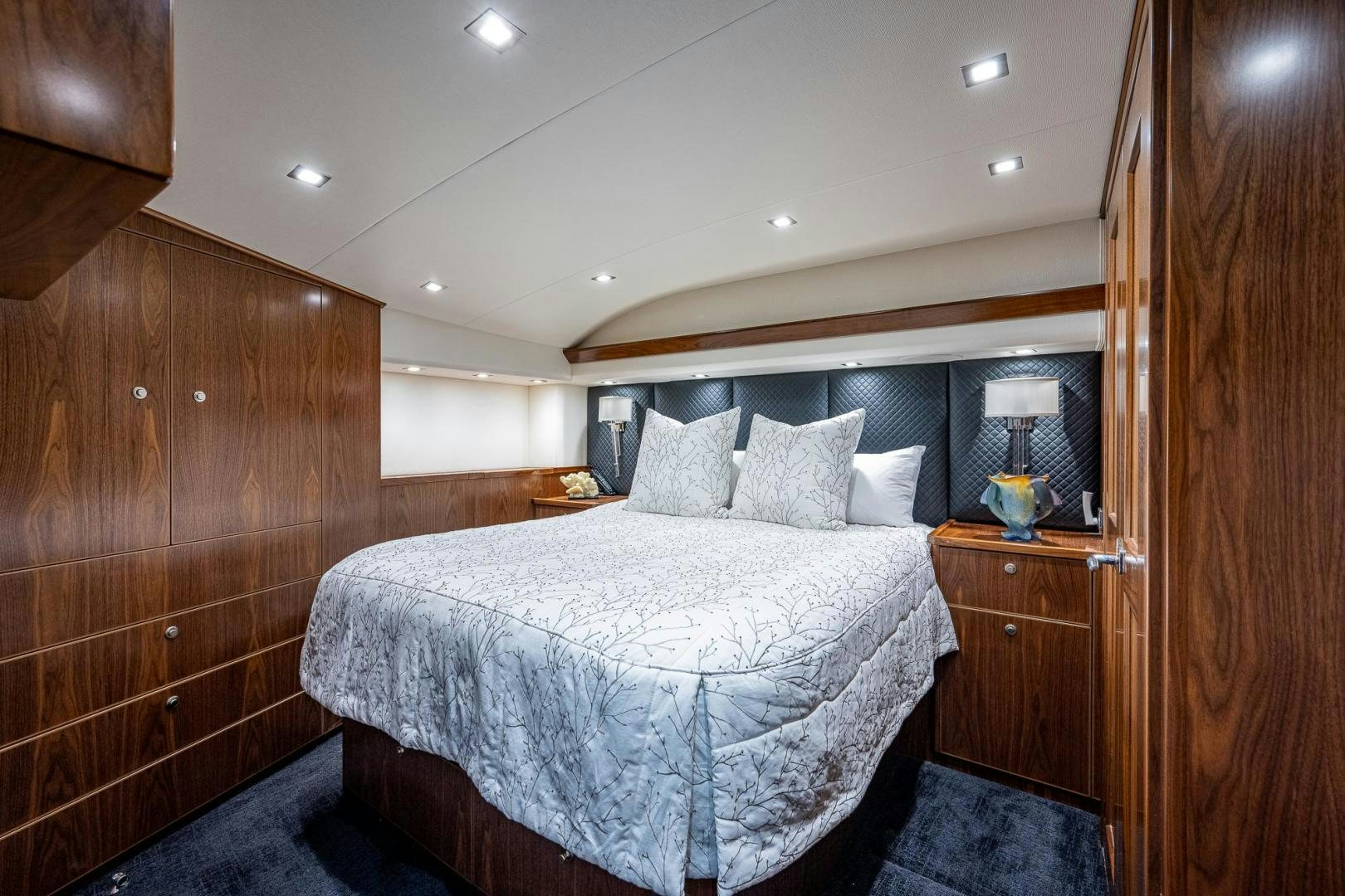 a bed in a wooden room aboard KEMOSABE Yacht for Sale