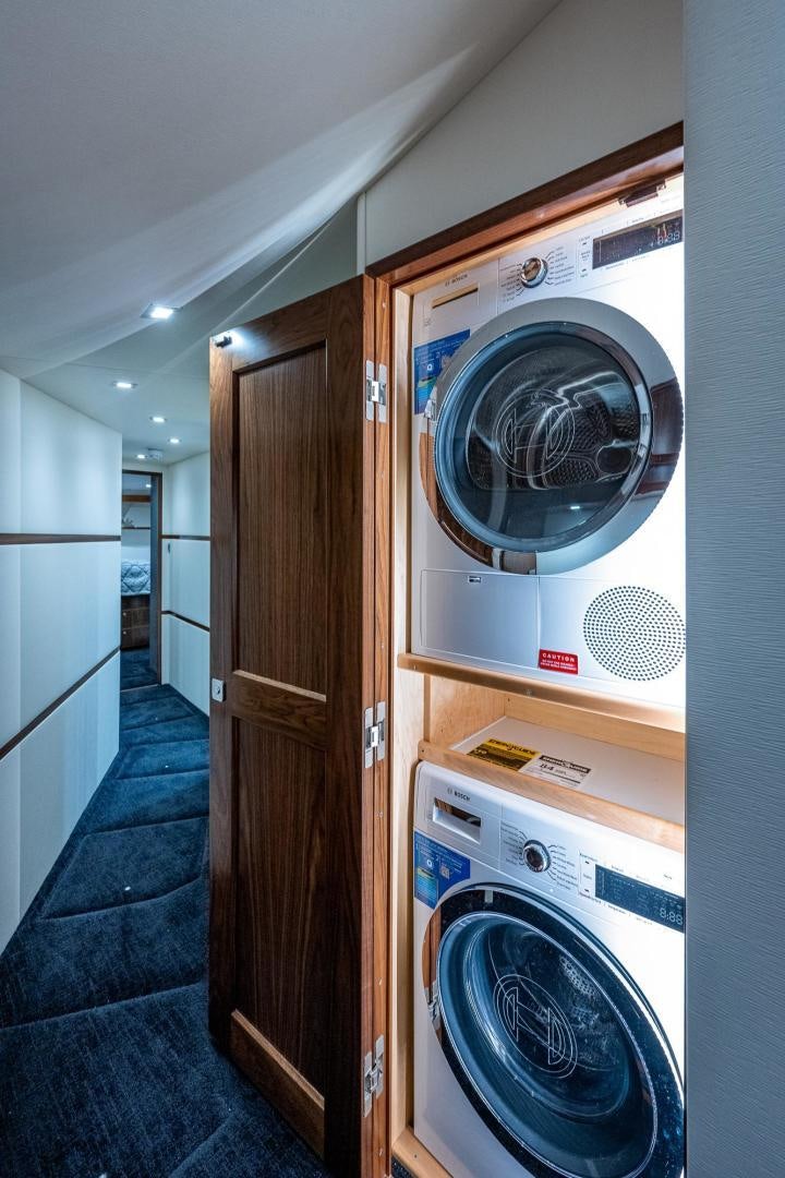 a washing machine in a room aboard KEMOSABE Yacht for Sale