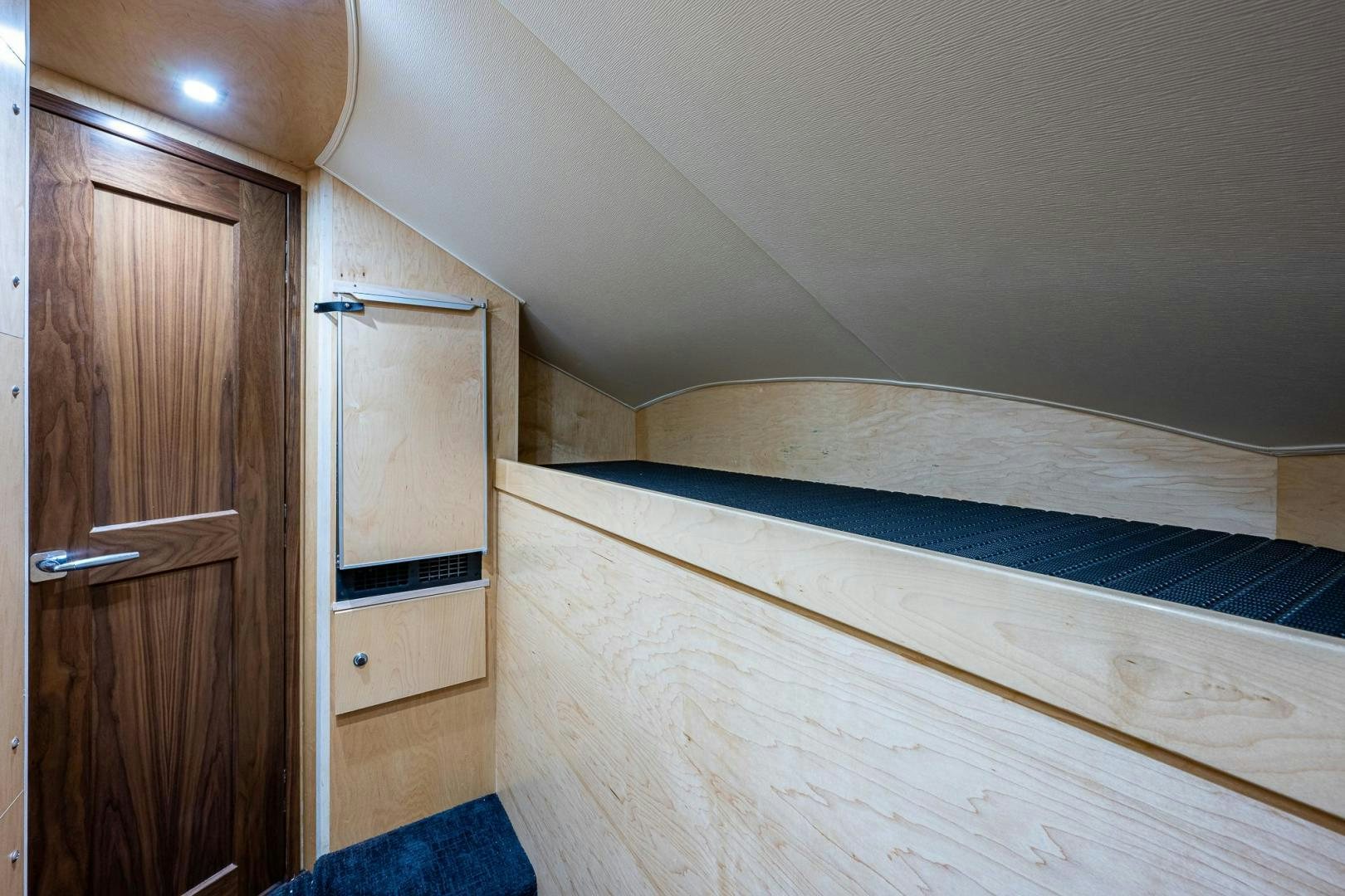 a room with a bed and a closet aboard KEMOSABE Yacht for Sale