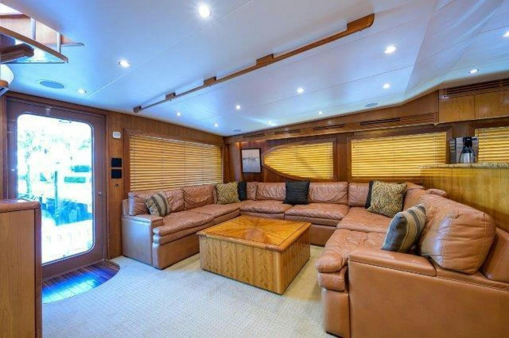 a living room with a couch and a table aboard THERAPY Yacht for Sale