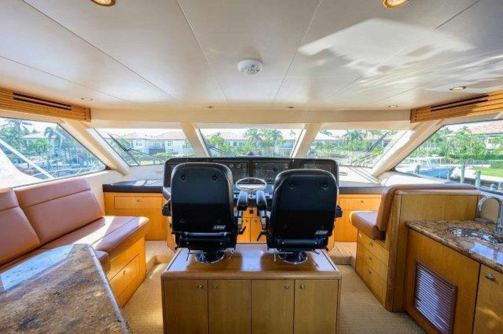 a living room with a couch and a computer aboard THERAPY Yacht for Sale