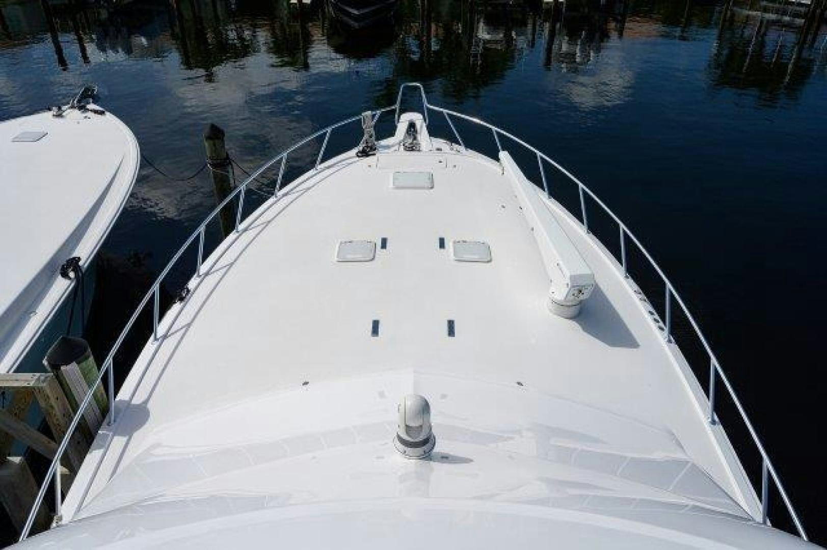 a white boat on a body of water aboard THERAPY Yacht for Sale