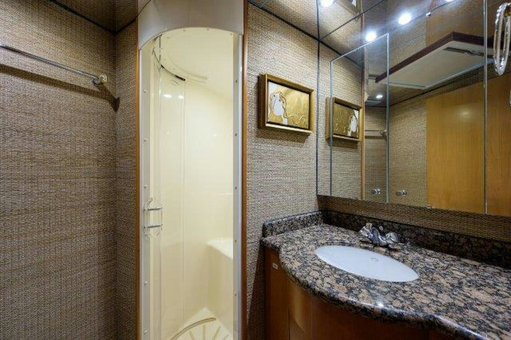 a bathroom with a marble countertop aboard THERAPY Yacht for Sale