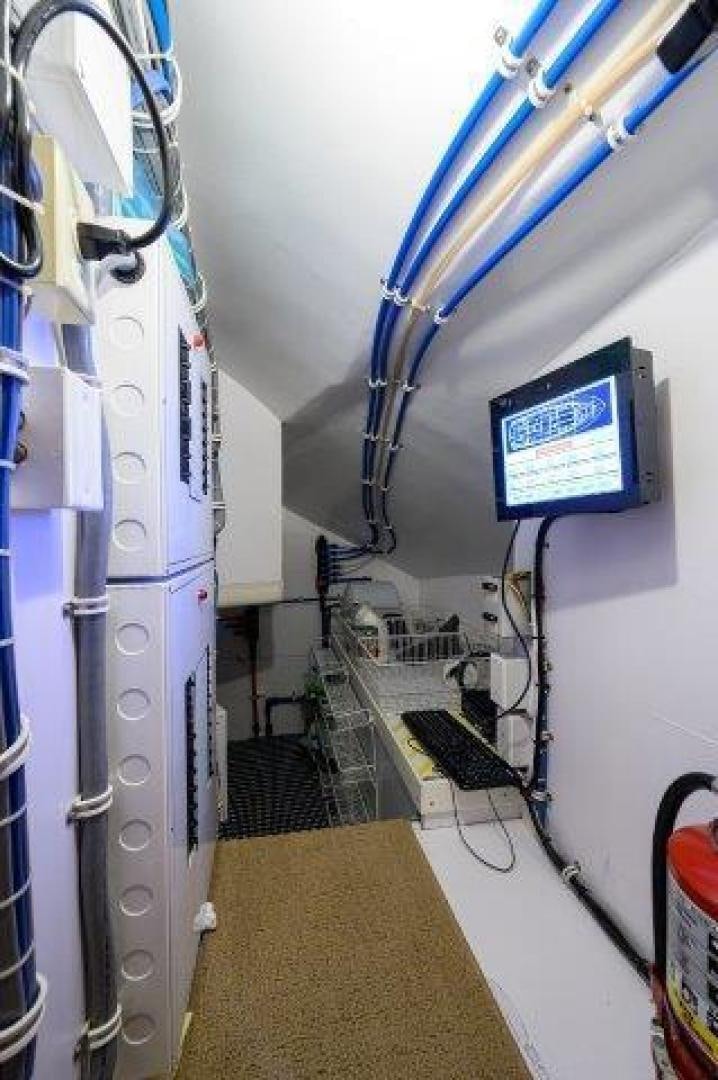 a machine inside a room aboard THERAPY Yacht for Sale