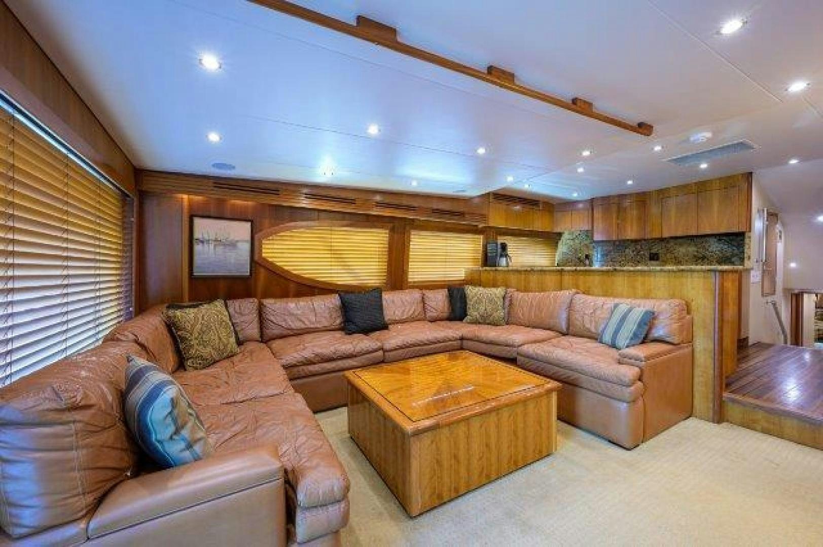 a living room with a couch and a coffee table aboard THERAPY Yacht for Sale