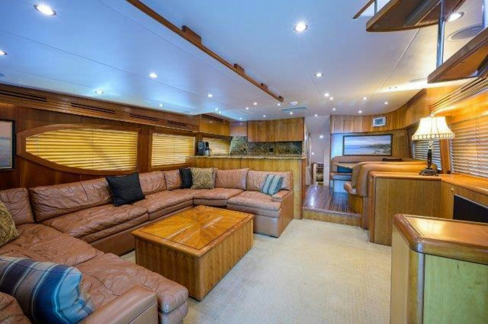 a living room with a couch and a coffee table aboard THERAPY Yacht for Sale