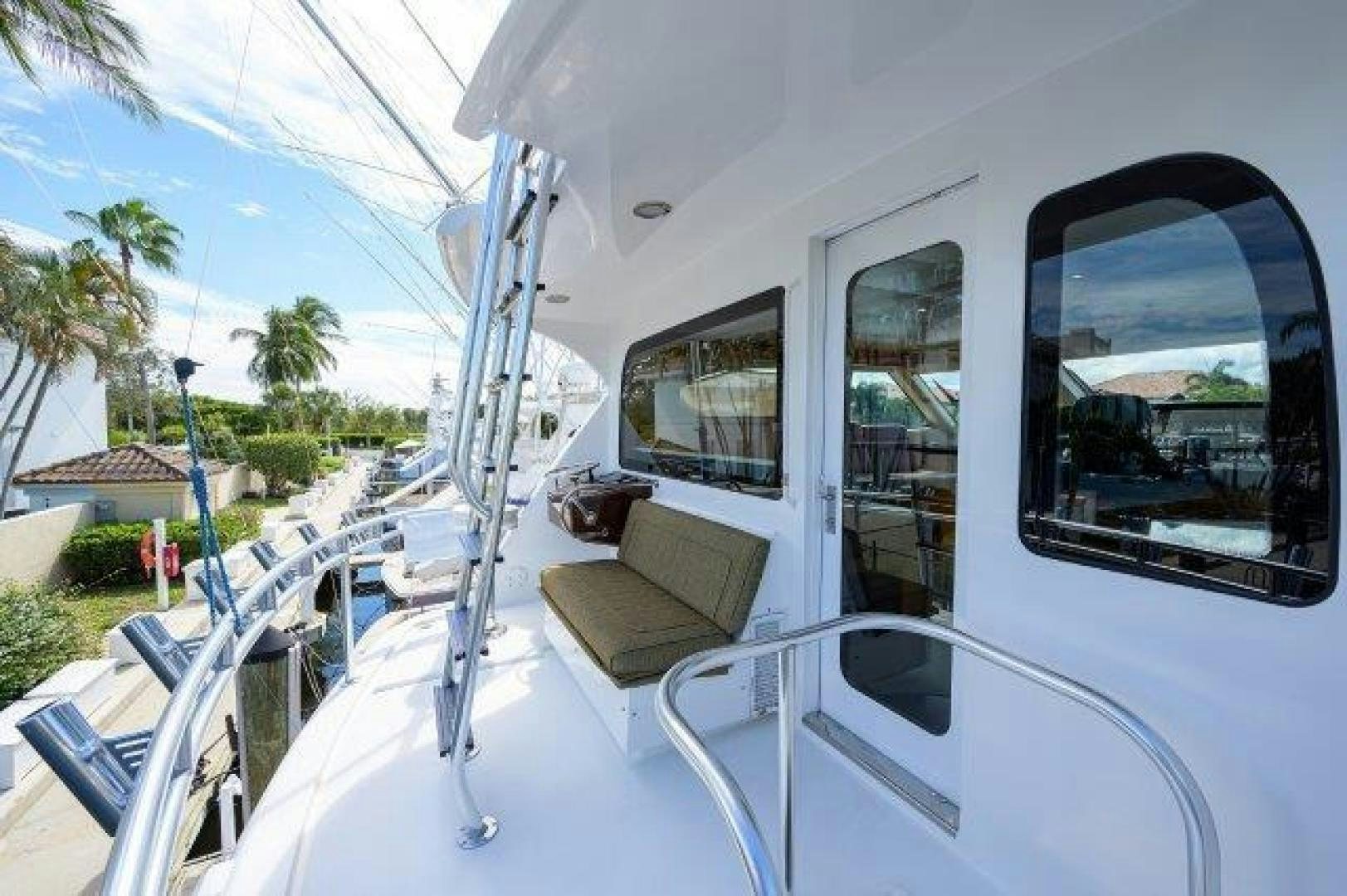 a white vehicle with a chair and a bench on the roof aboard THERAPY Yacht for Sale
