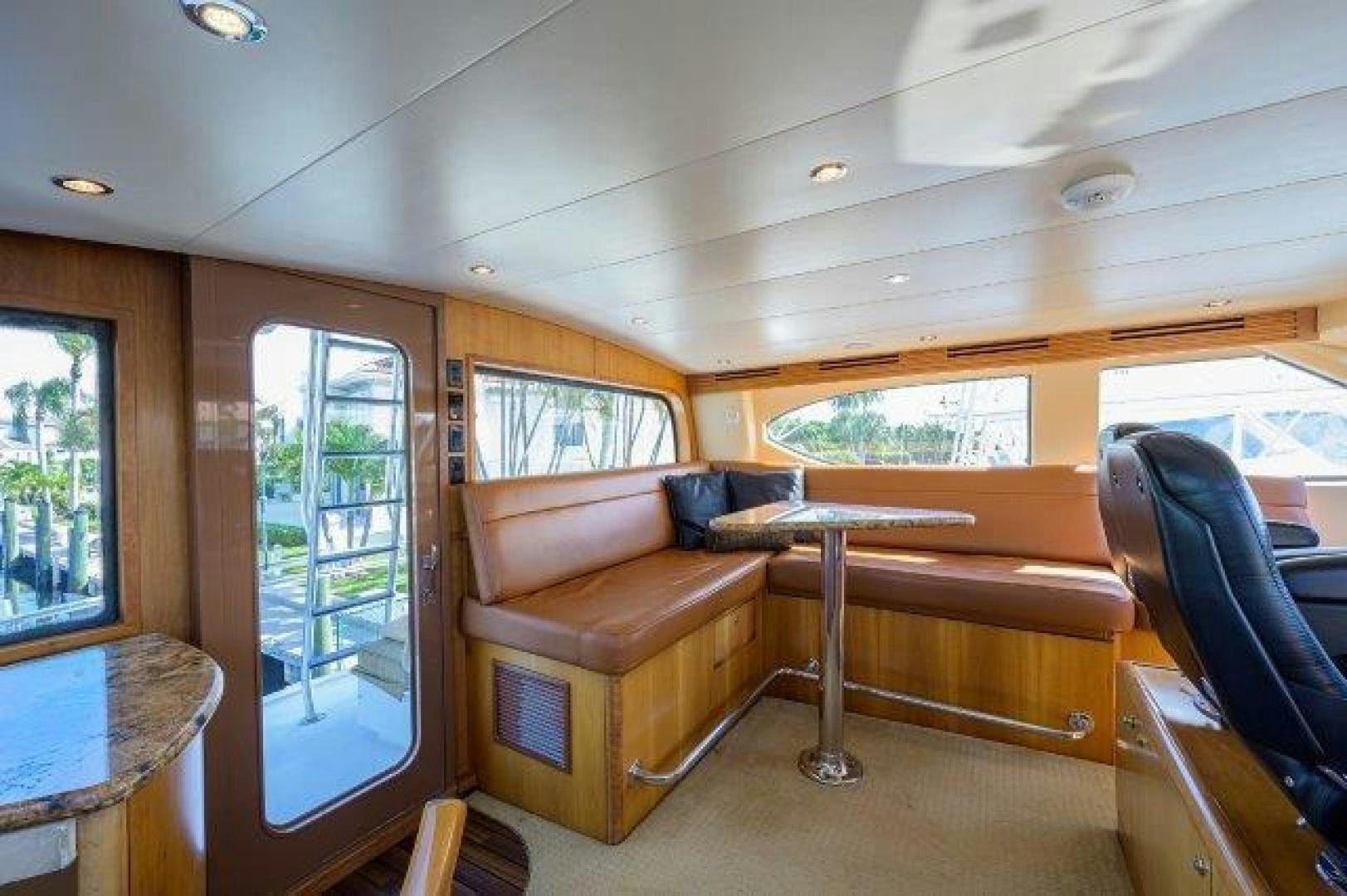 a living room with a couch and a table aboard THERAPY Yacht for Sale