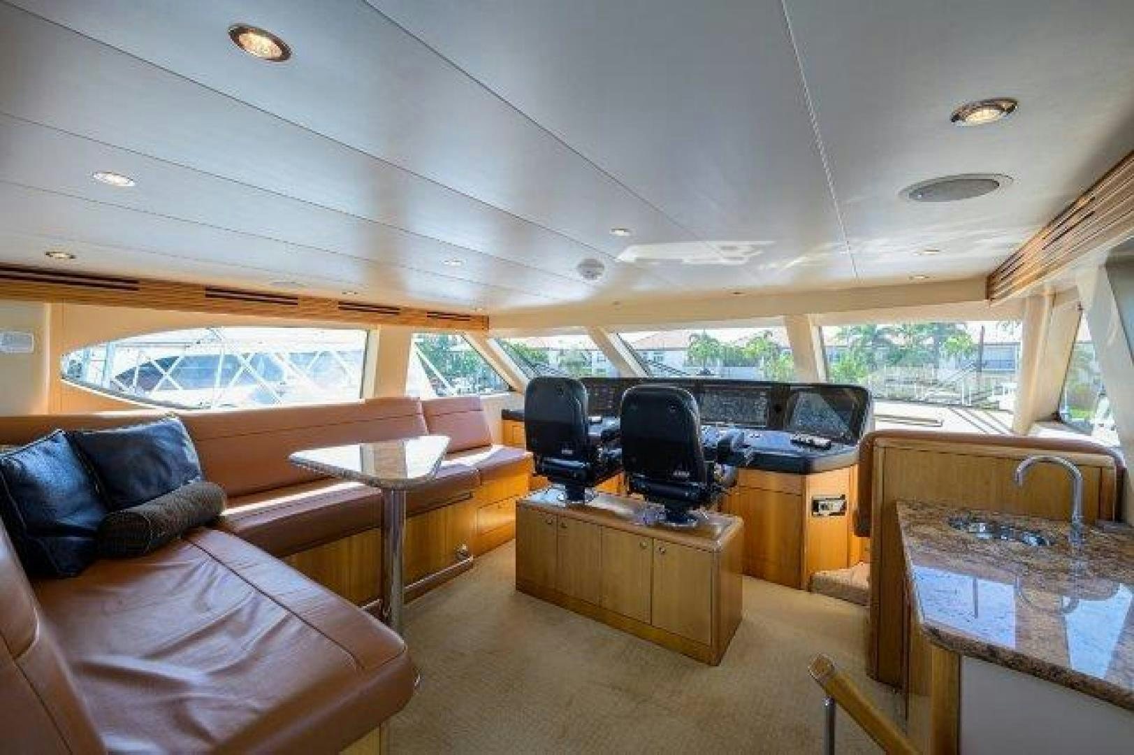 inside of a rv with a couch and a table and chairs aboard THERAPY Yacht for Sale