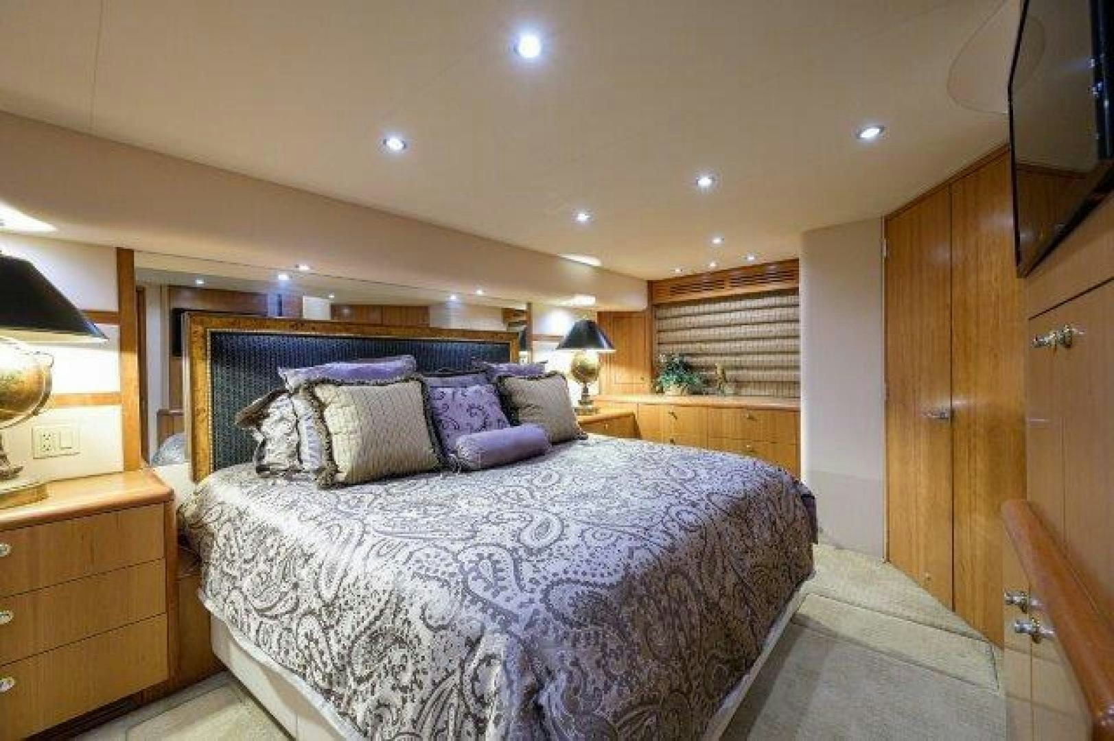 a bed in a bedroom aboard THERAPY Yacht for Sale