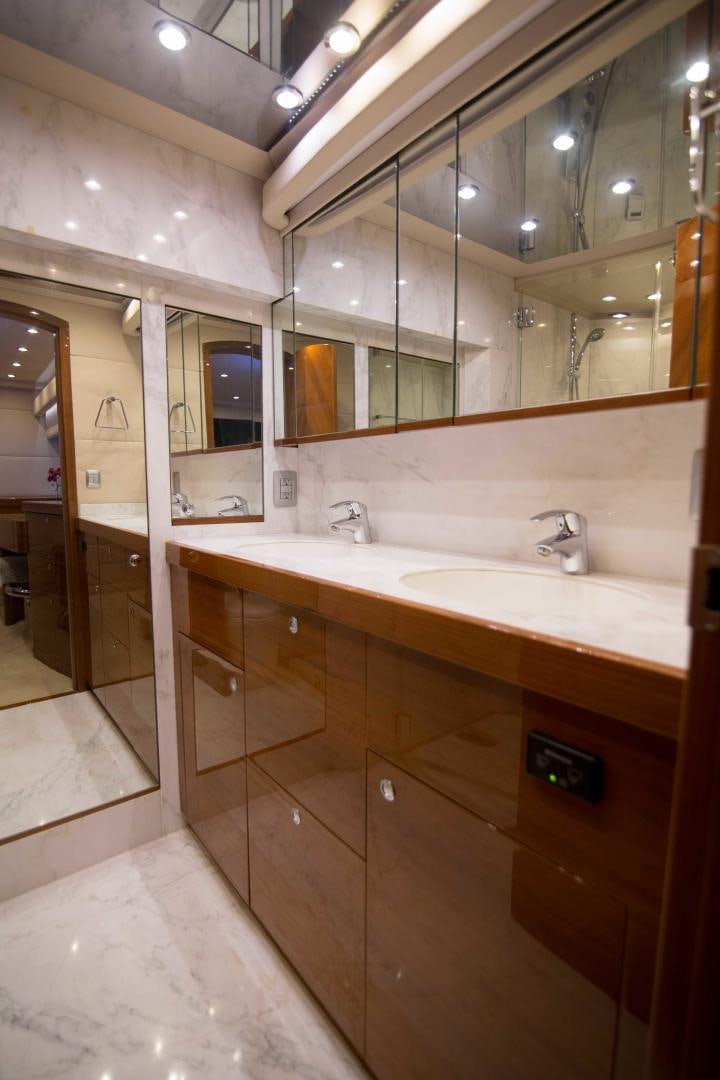 a bathroom with a large mirror aboard PREDATOR Yacht for Sale