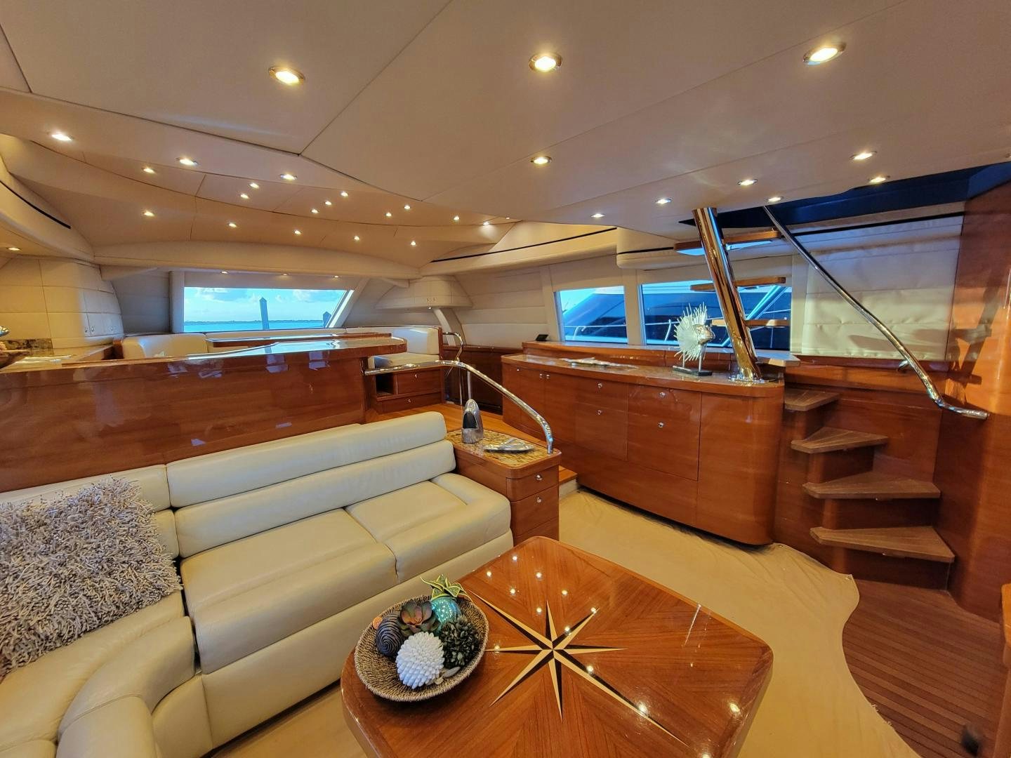 a living room with a couch and a tv aboard PREDATOR Yacht for Sale
