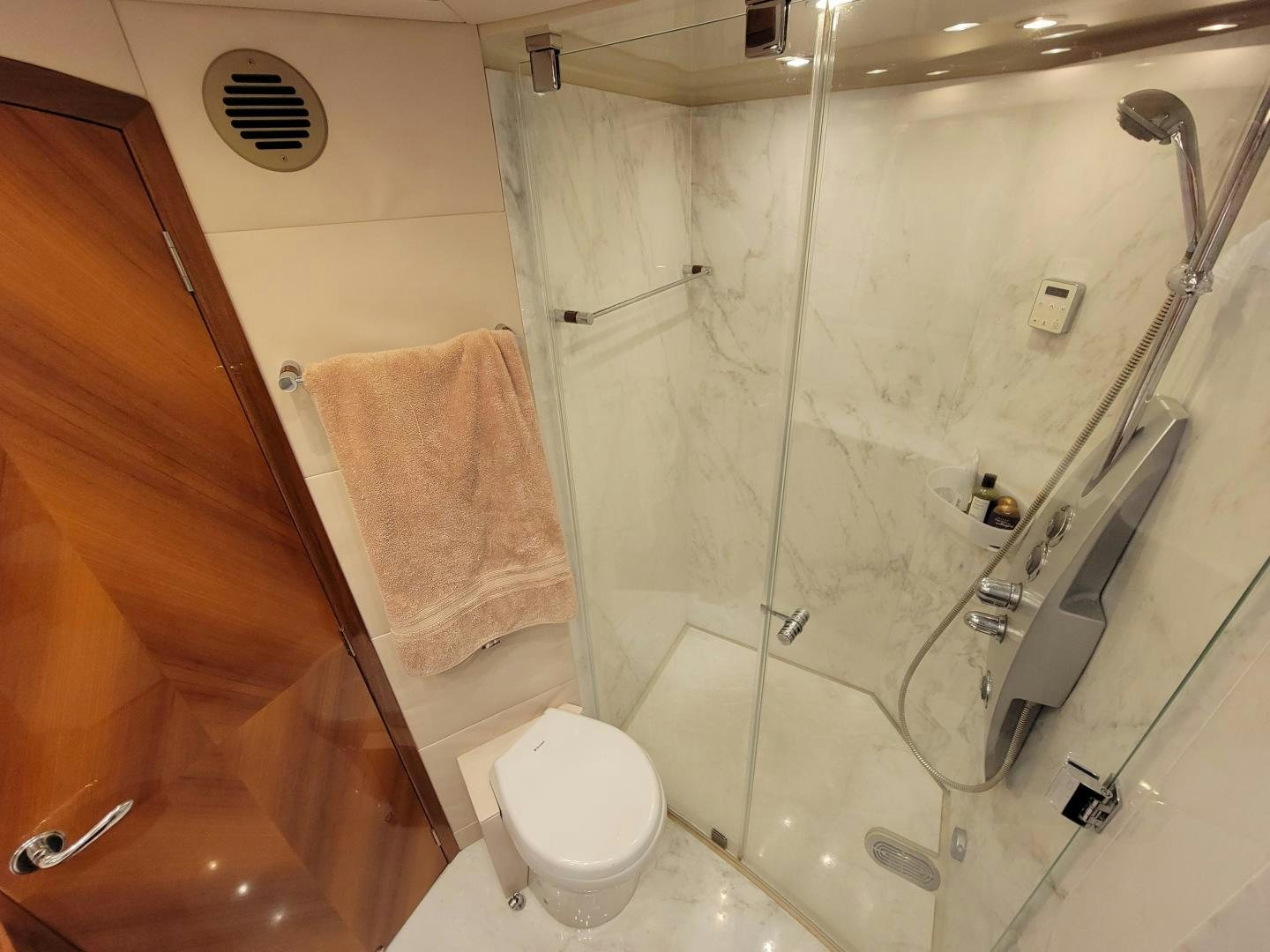 a bathroom with a shower and toilet aboard PREDATOR Yacht for Sale