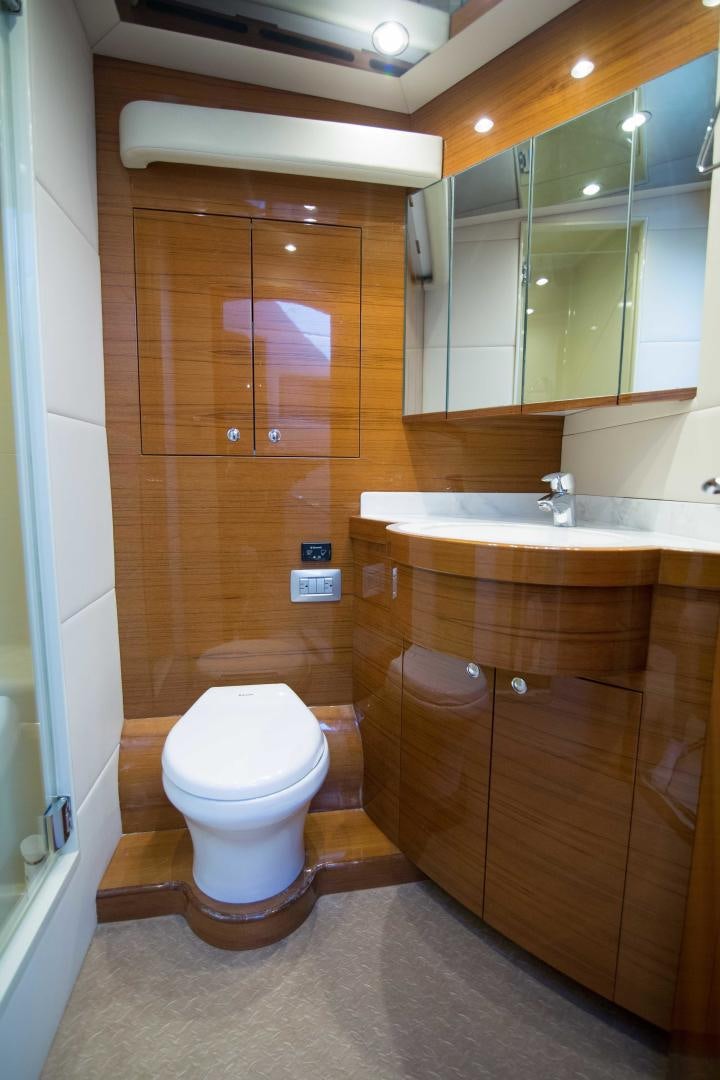a bathroom with a toilet and sink aboard PREDATOR Yacht for Sale