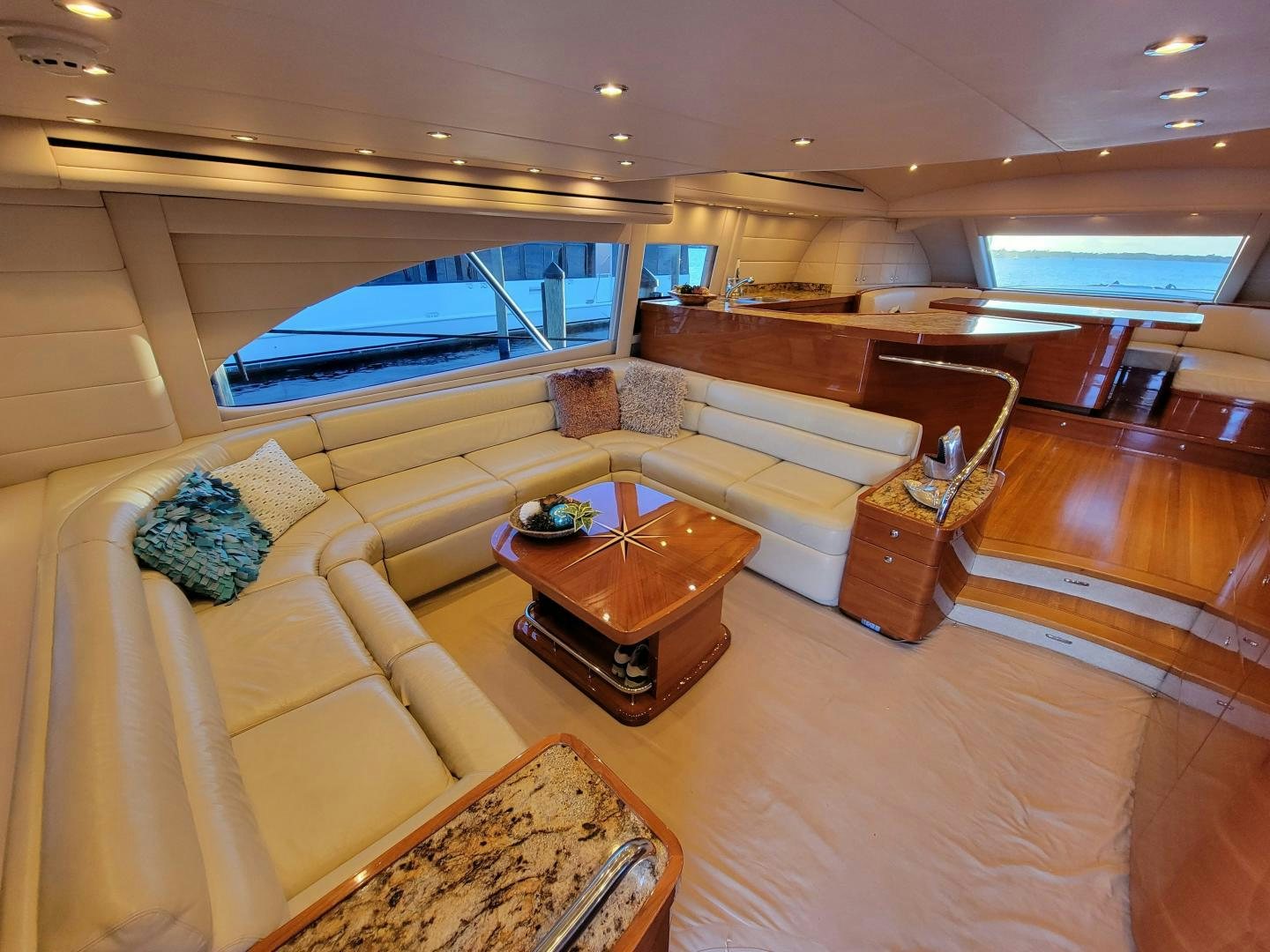 a living room with a large window aboard PREDATOR Yacht for Sale