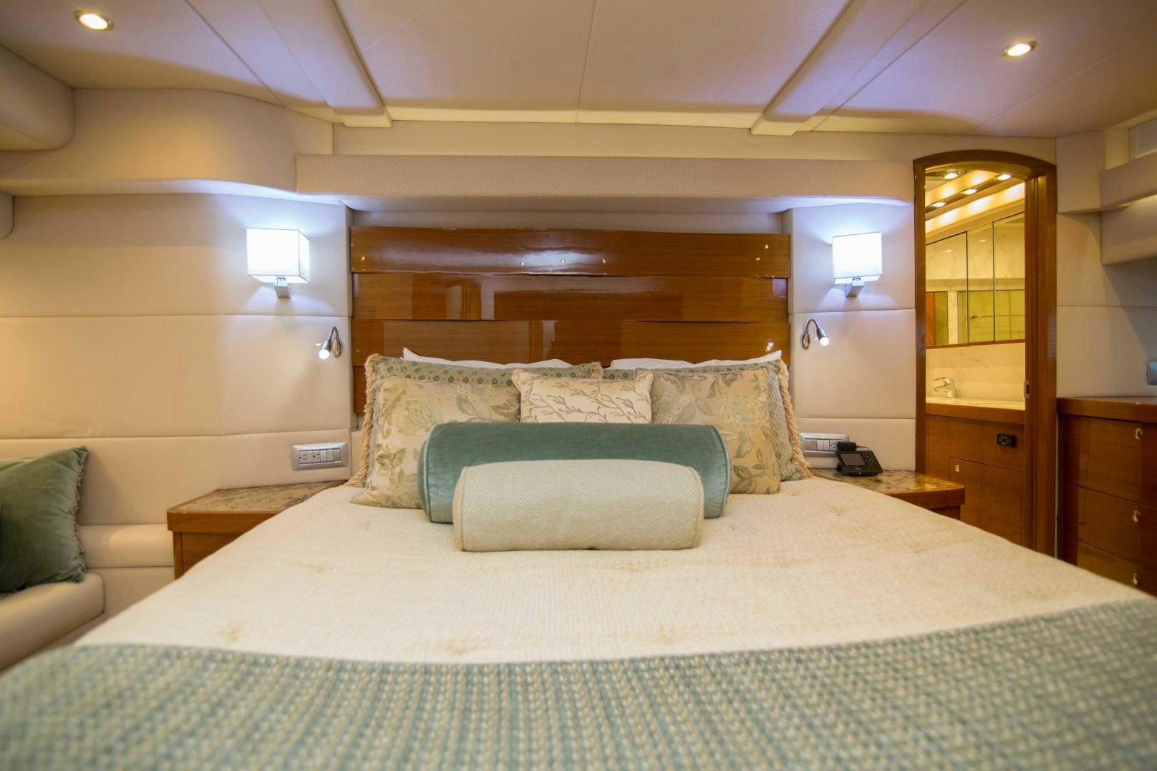 a bed with pillows aboard PREDATOR Yacht for Sale