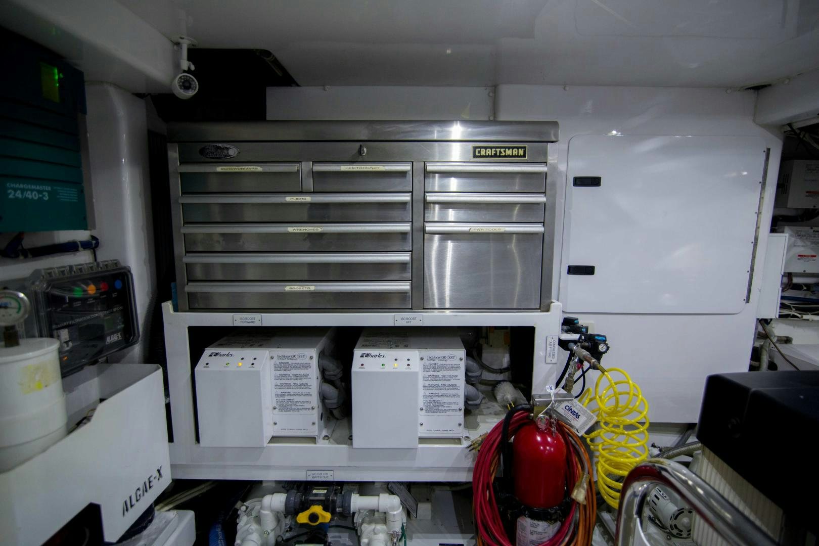 a white machine with a yellow tag aboard PREDATOR Yacht for Sale