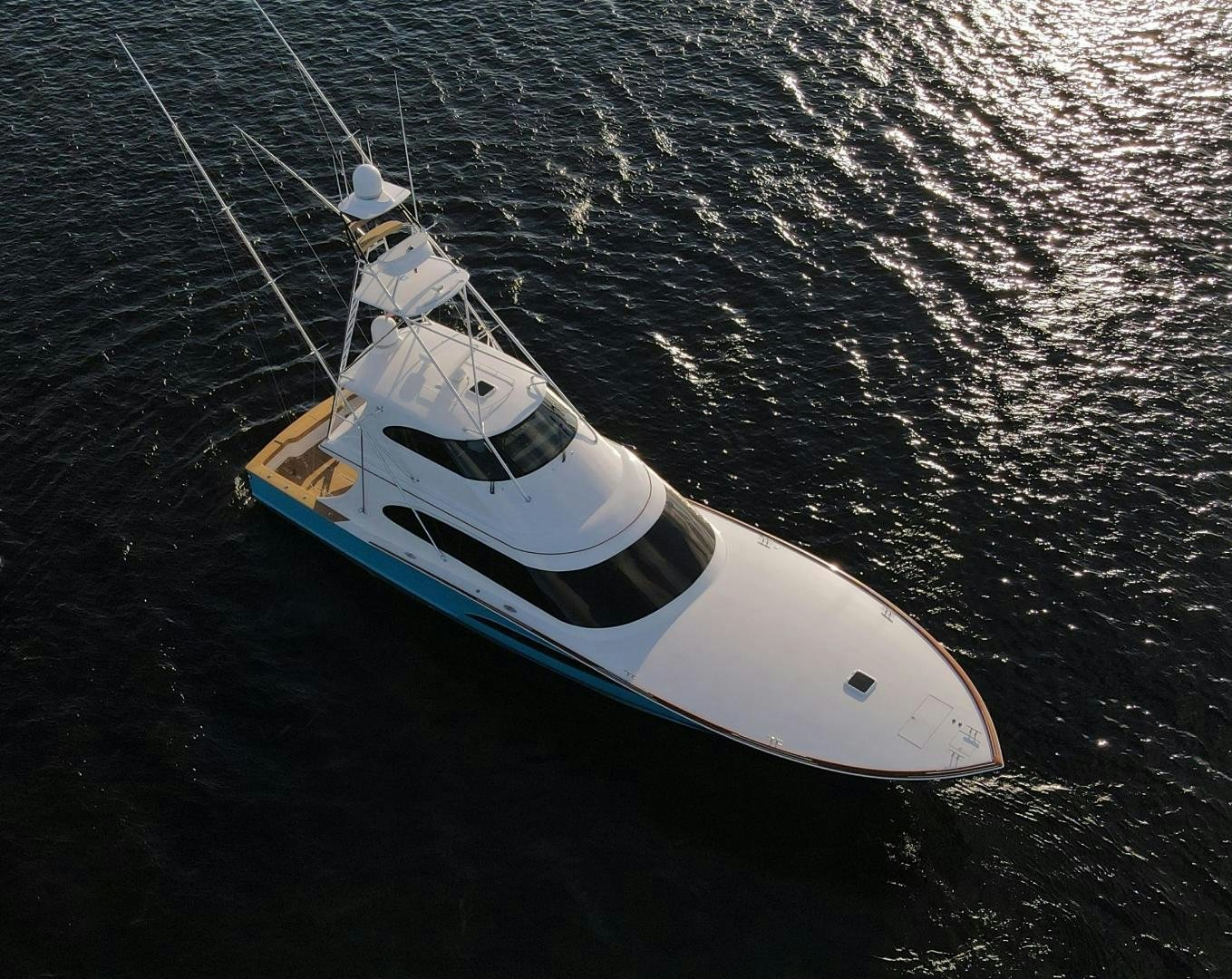 a white boat in the water aboard PREDATOR Yacht for Sale