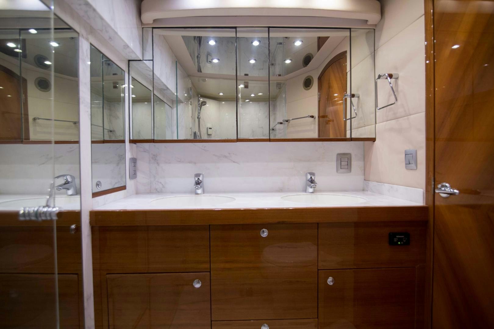 a bathroom with a large mirror aboard PREDATOR Yacht for Sale
