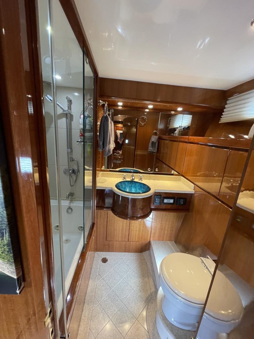 a bathroom with a toilet and a sink aboard MIA & MAUI JIM Yacht for Sale