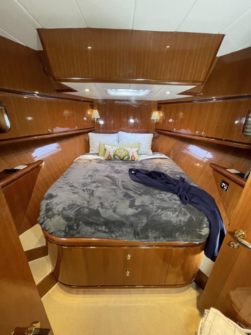 a bed in a wooden room aboard MIA & MAUI JIM Yacht for Sale