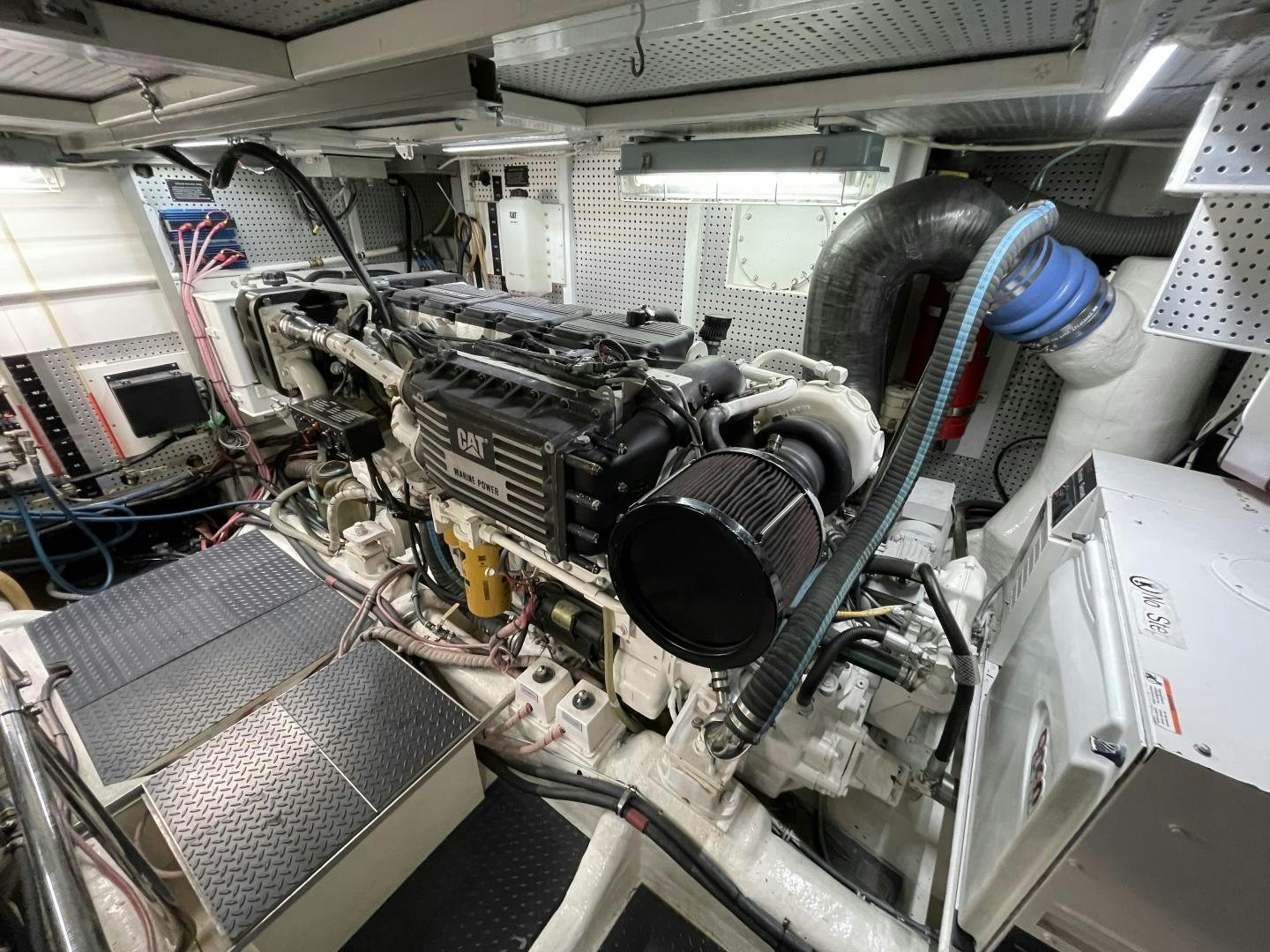 a close-up of a car engine aboard MIA & MAUI JIM Yacht for Sale