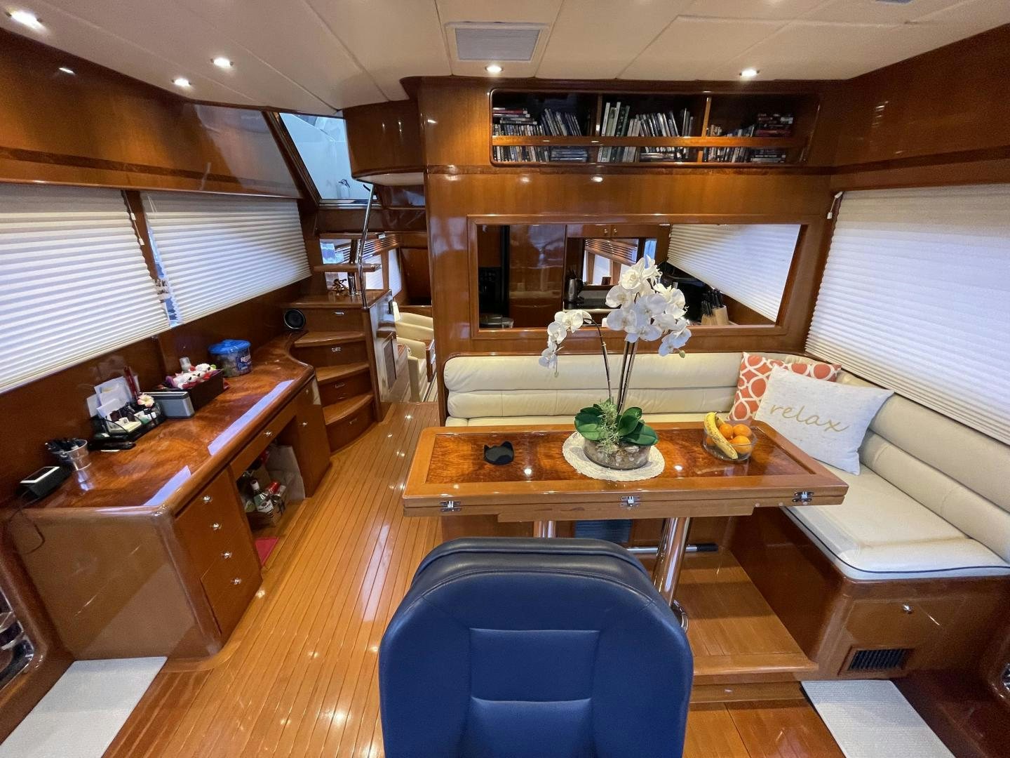 a room with a table and chairs aboard MIA & MAUI JIM Yacht for Sale