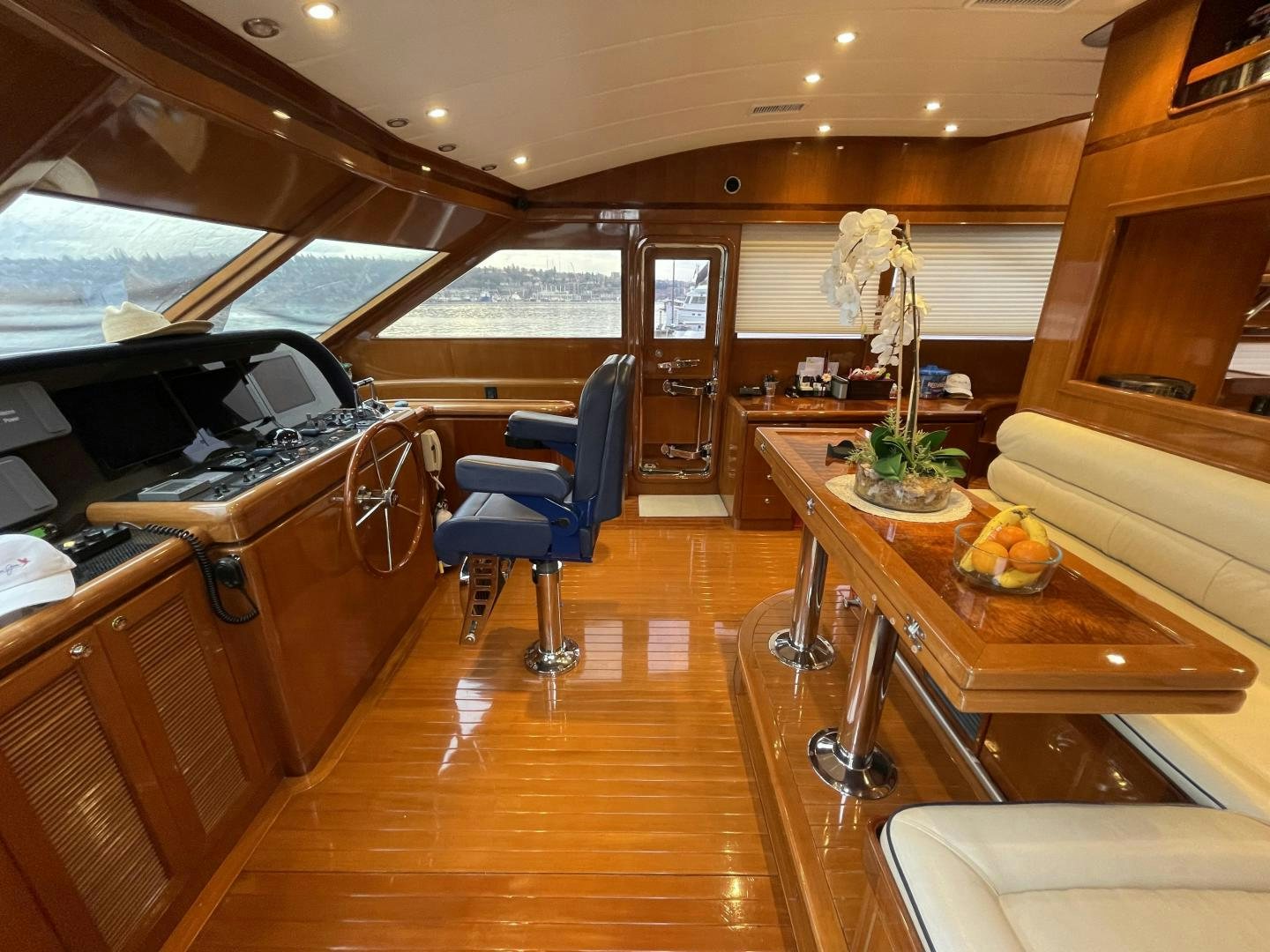 a room with a table and chairs aboard MIA & MAUI JIM Yacht for Sale