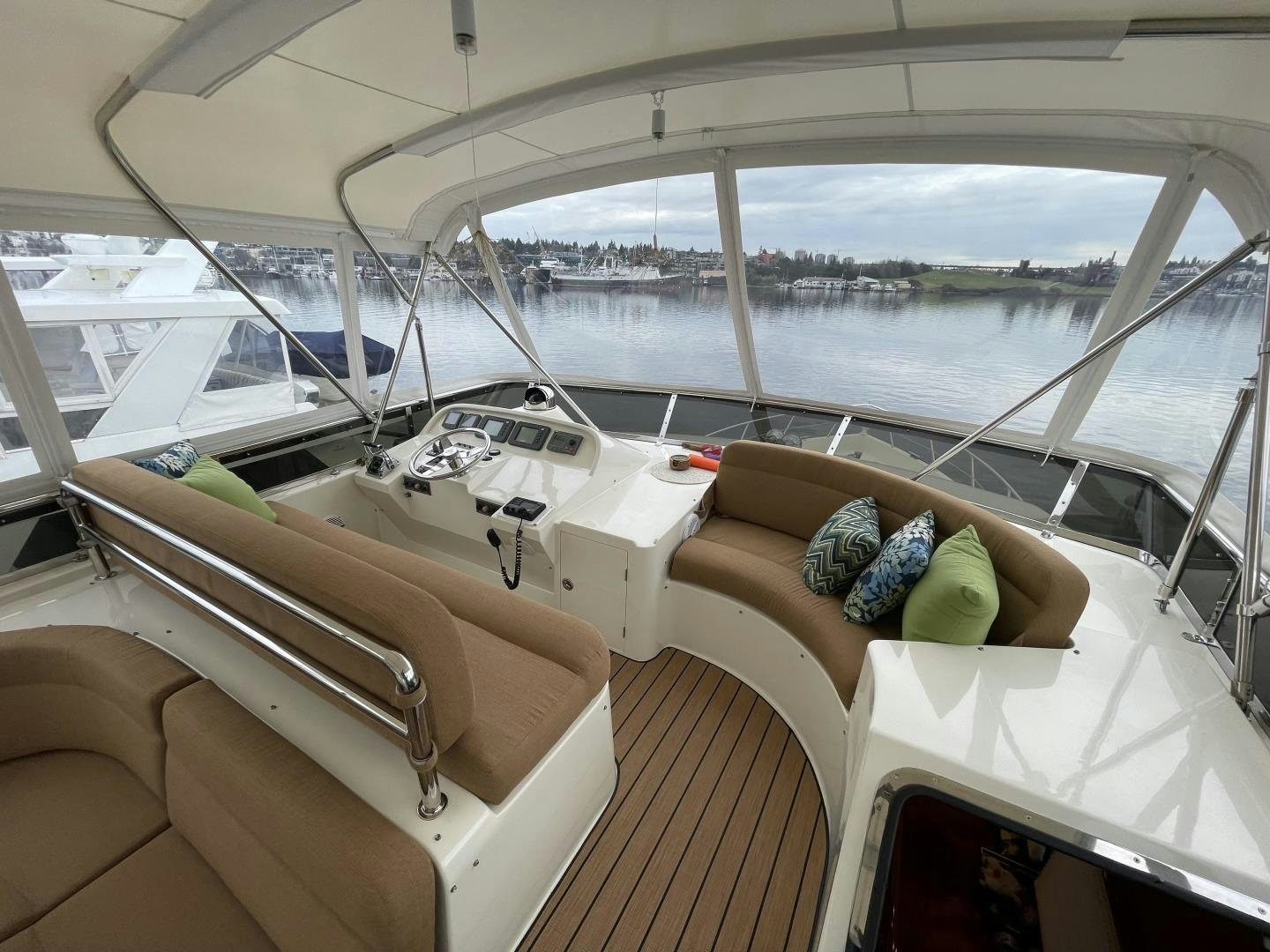 a boat with a couch and a table on it aboard MIA & MAUI JIM Yacht for Sale