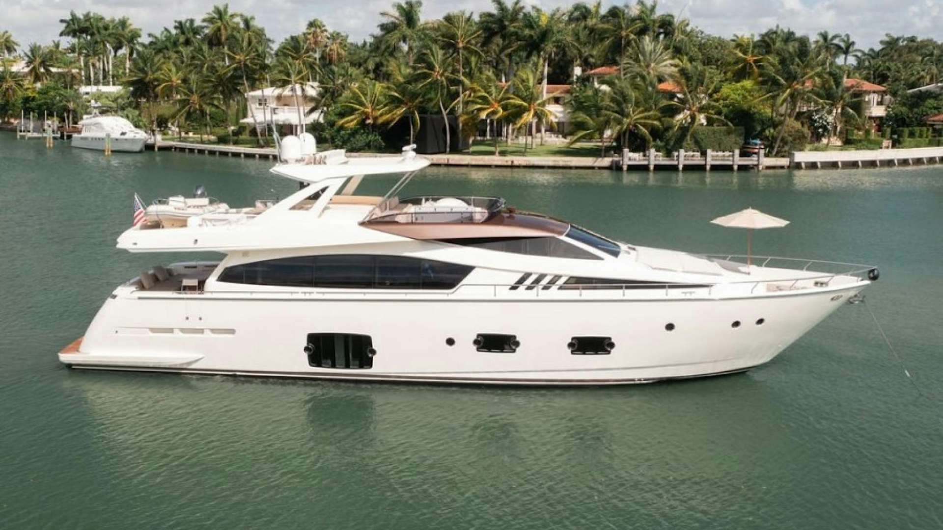 a white yacht in the water aboard LIVING LIFE 3 Yacht for Sale