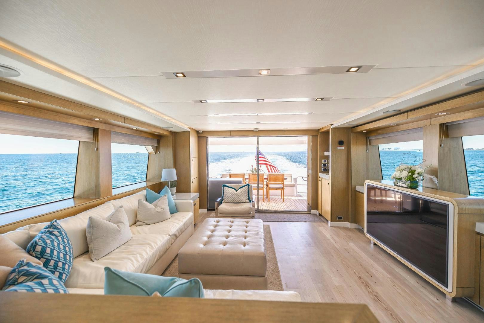a living room with a large window aboard BELLA SKY Yacht for Sale