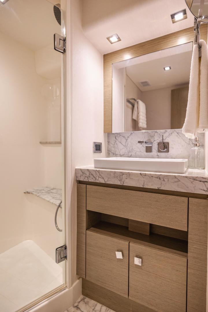 a bathroom with a sink and a mirror aboard BELLA SKY Yacht for Sale