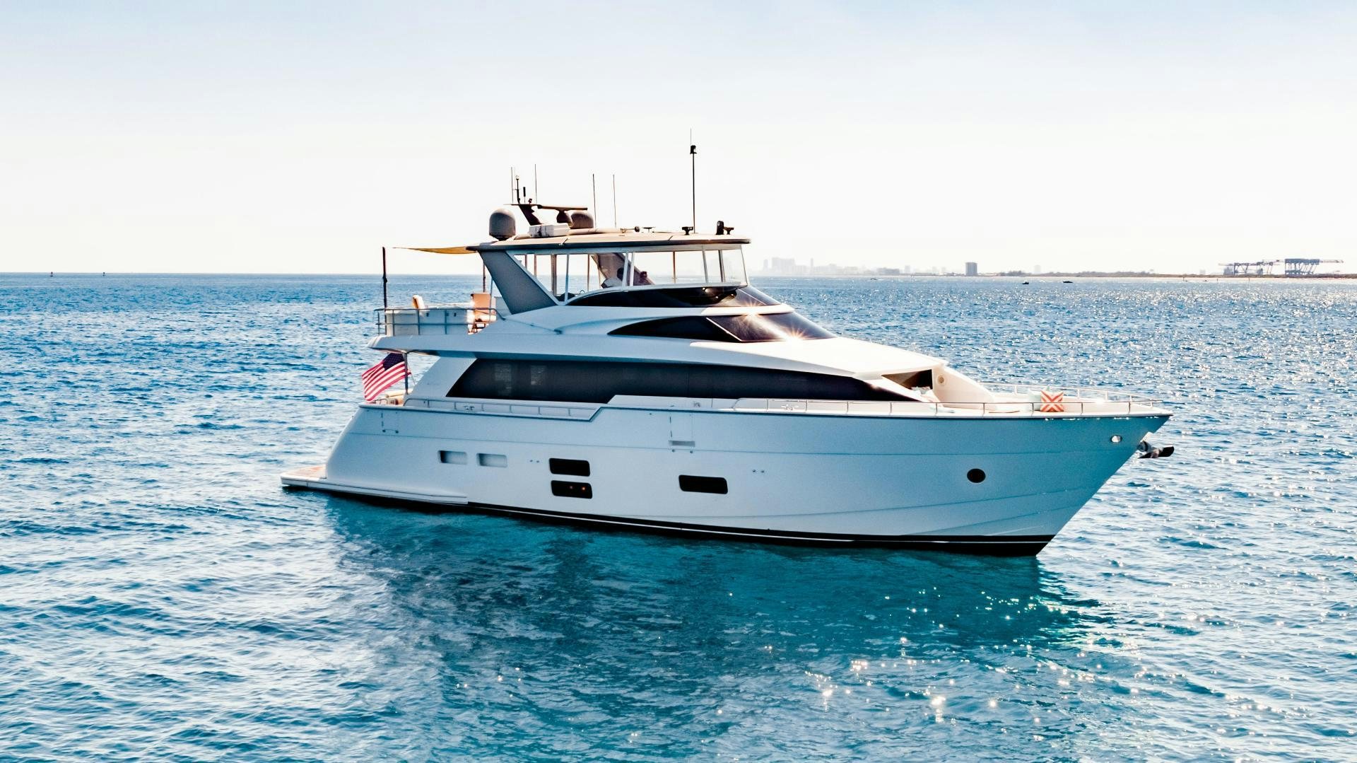 a white yacht in the water aboard BELLA SKY Yacht for Sale