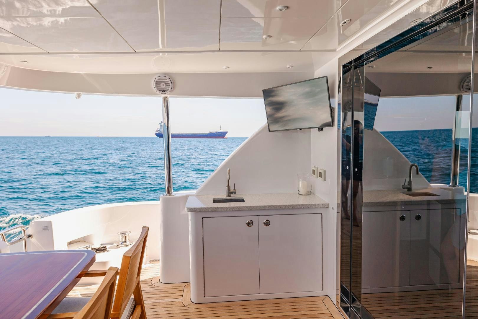 a room with a view of the ocean and the deck aboard BELLA SKY Yacht for Sale