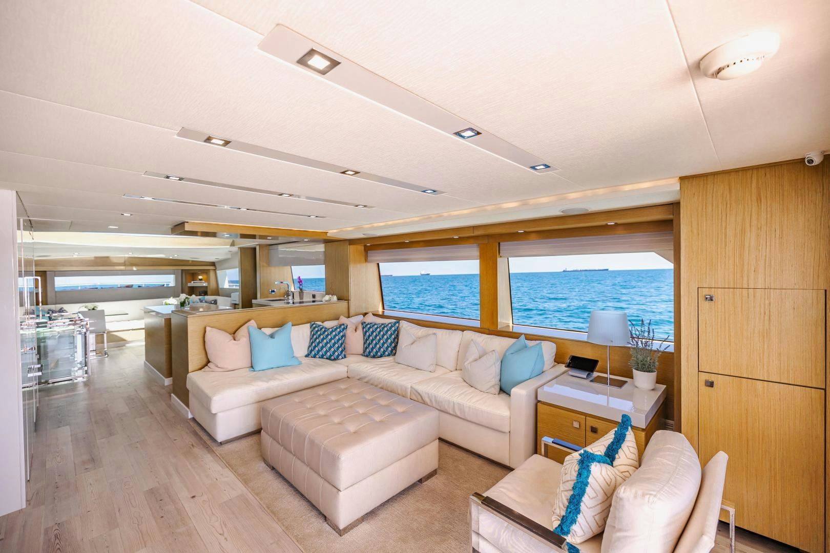 a living room with a large window aboard BELLA SKY Yacht for Sale