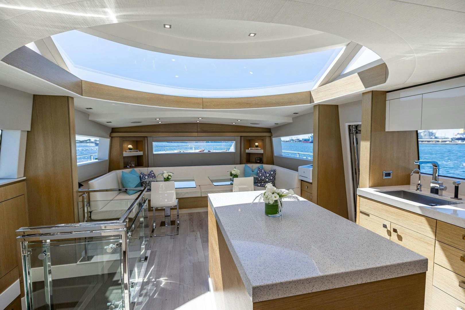 a large kitchen with a large island aboard BELLA SKY Yacht for Sale