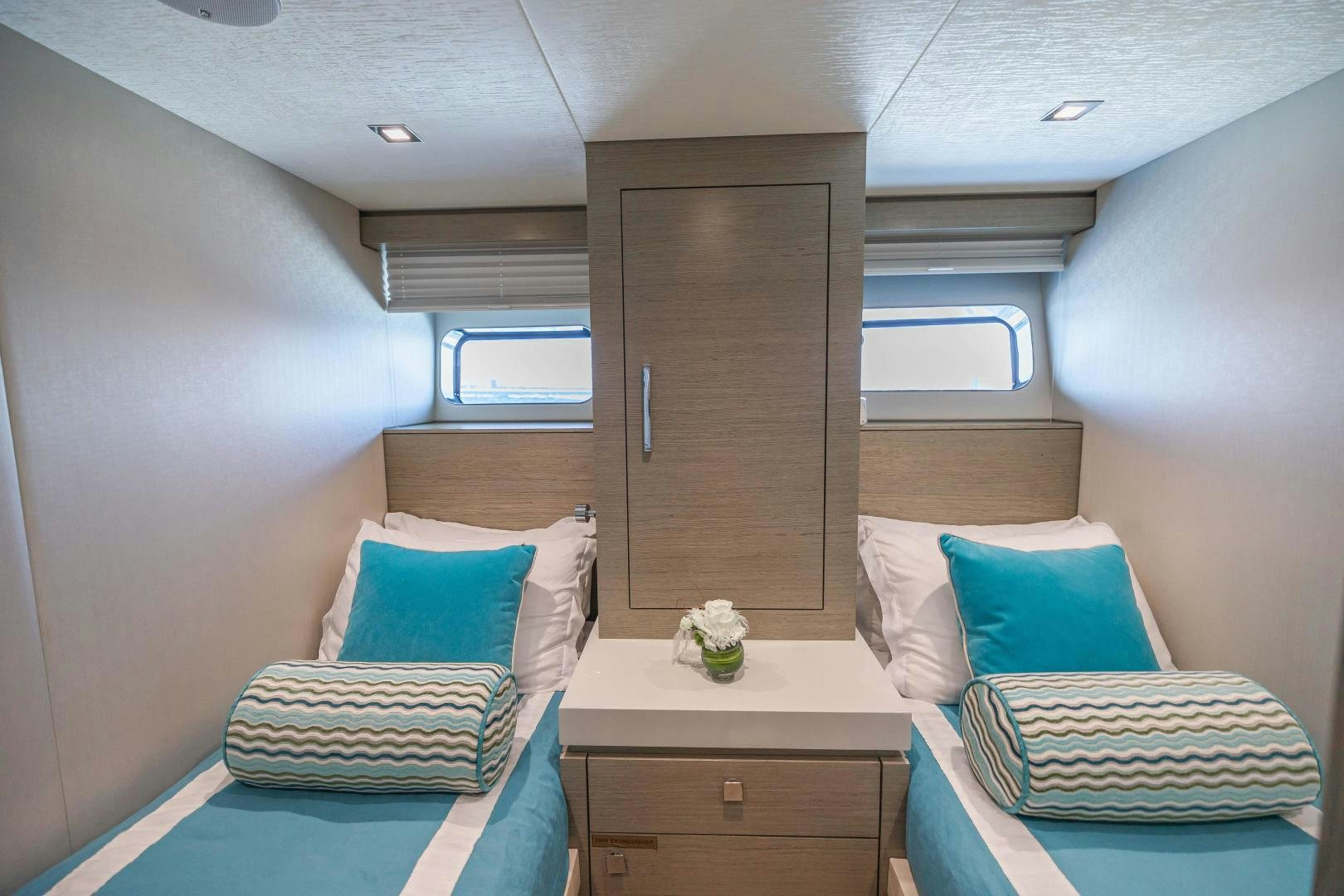 a room with a bed and a desk aboard BELLA SKY Yacht for Sale