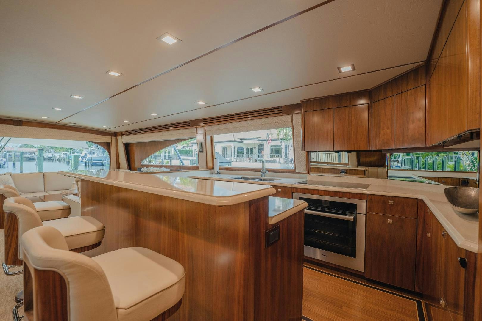 a kitchen with wooden cabinets aboard AUSPICIOUS Yacht for Sale