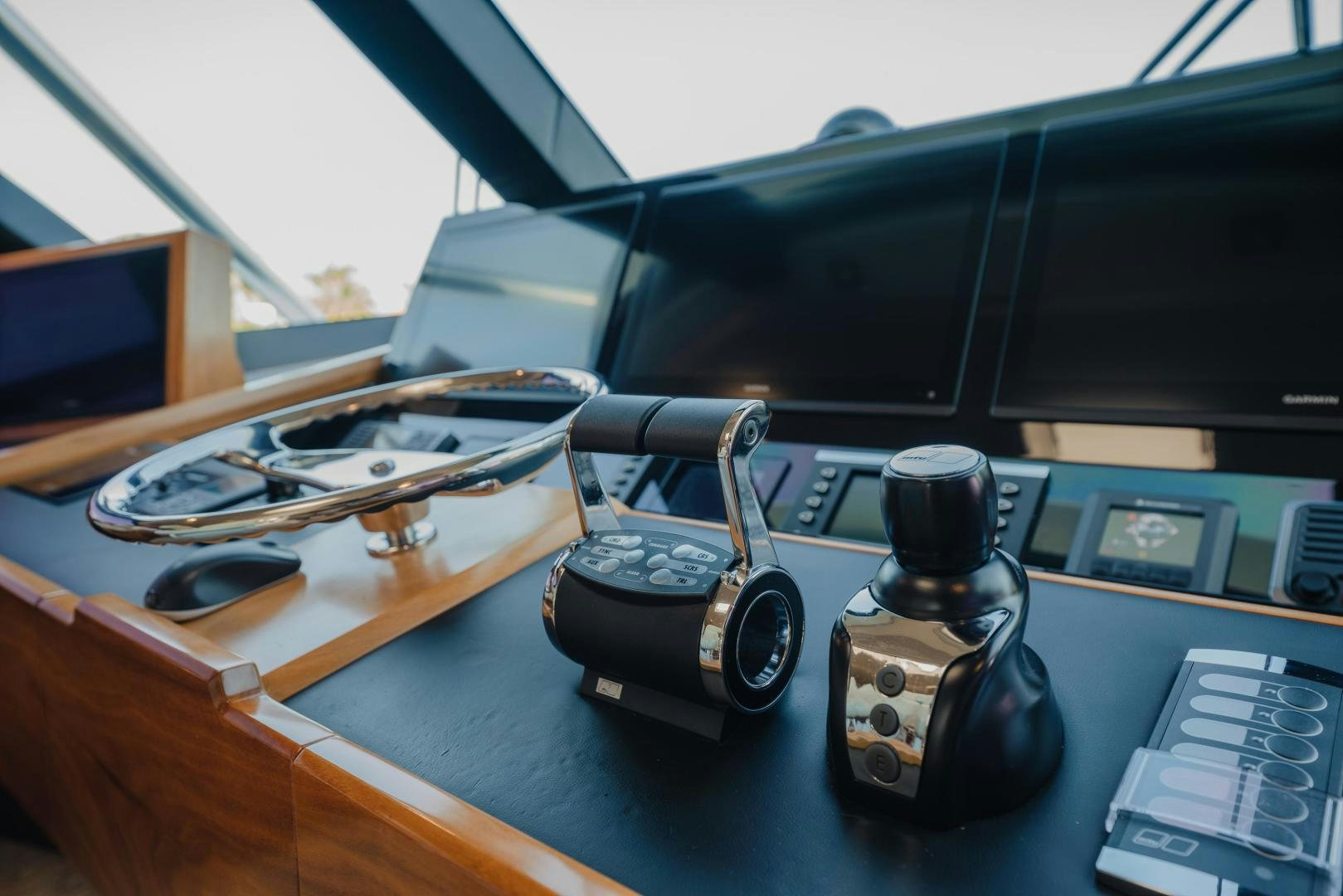 a wooden table with a couple of guns and a camera on it aboard AUSPICIOUS Yacht for Sale