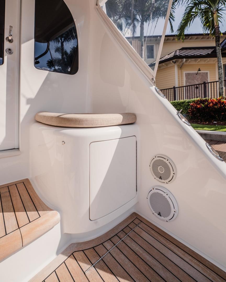 a white rectangular object with a round base on a wooden surface aboard AUSPICIOUS Yacht for Sale