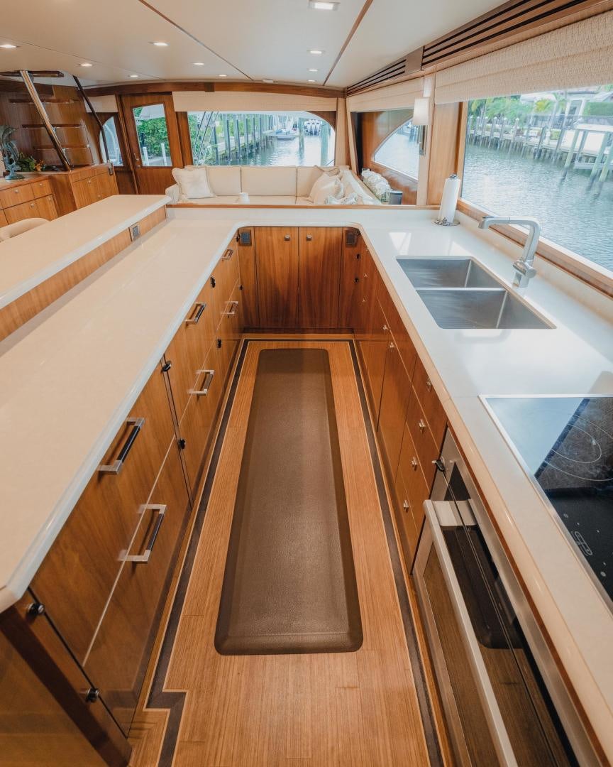 a large kitchen with a large window aboard AUSPICIOUS Yacht for Sale