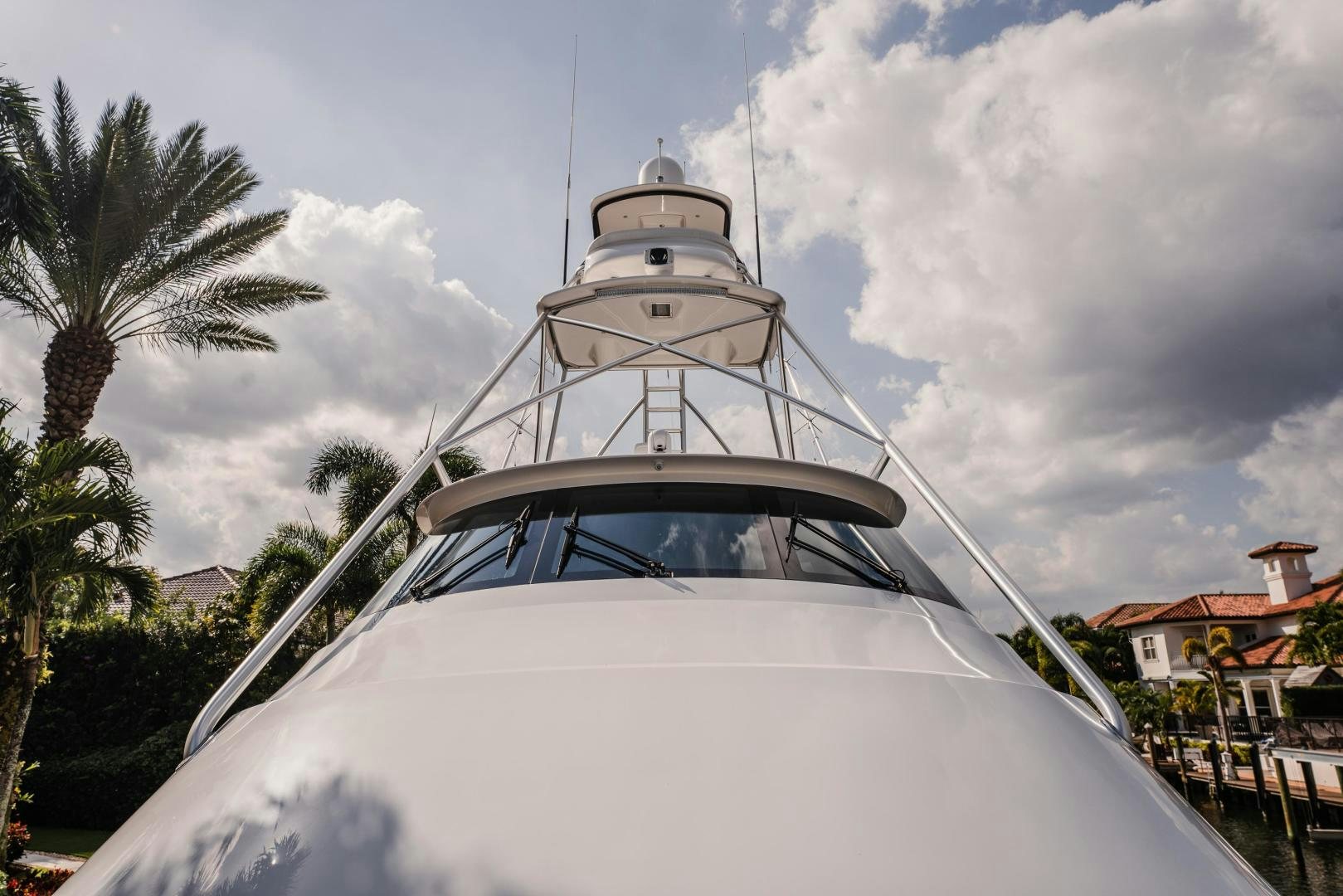 a white boat with a white tower aboard AUSPICIOUS Yacht for Sale