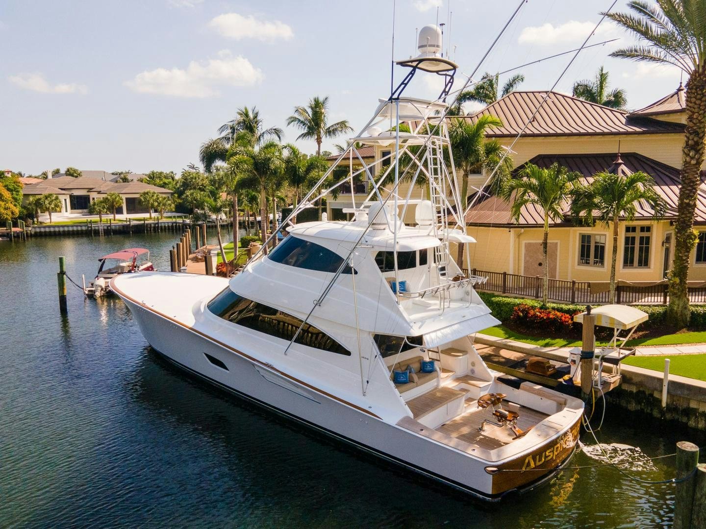 a boat docked at a pier aboard AUSPICIOUS Yacht for Sale