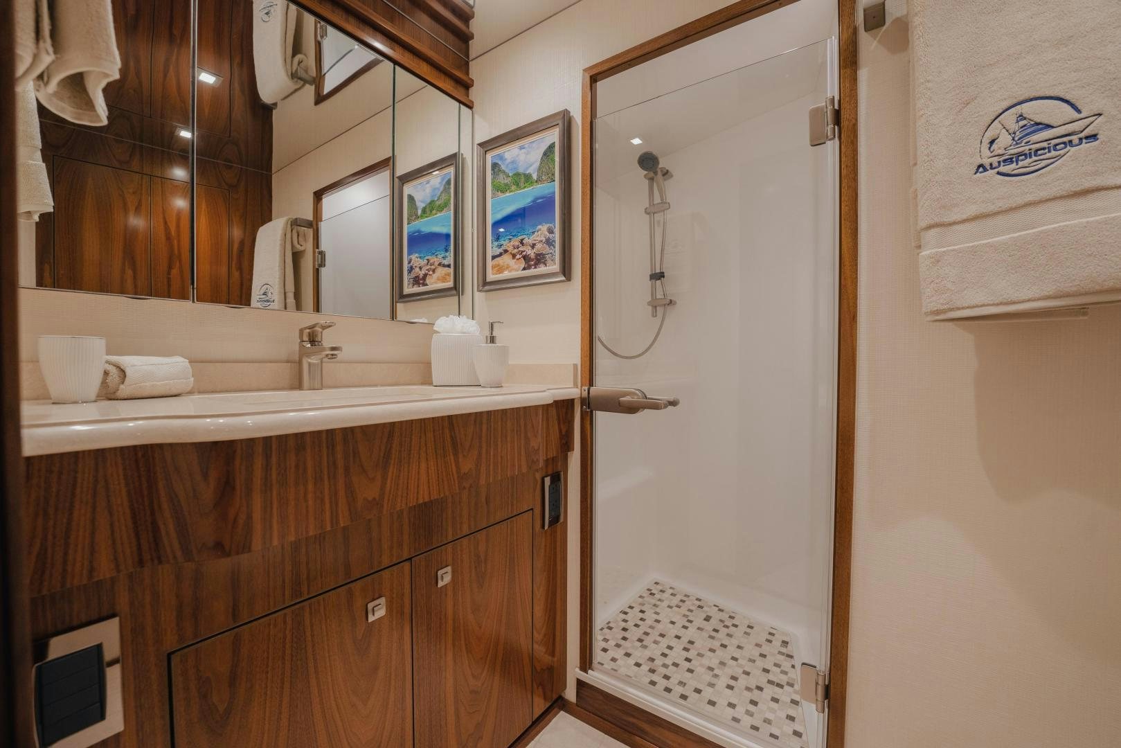 a bathroom with a large mirror aboard AUSPICIOUS Yacht for Sale