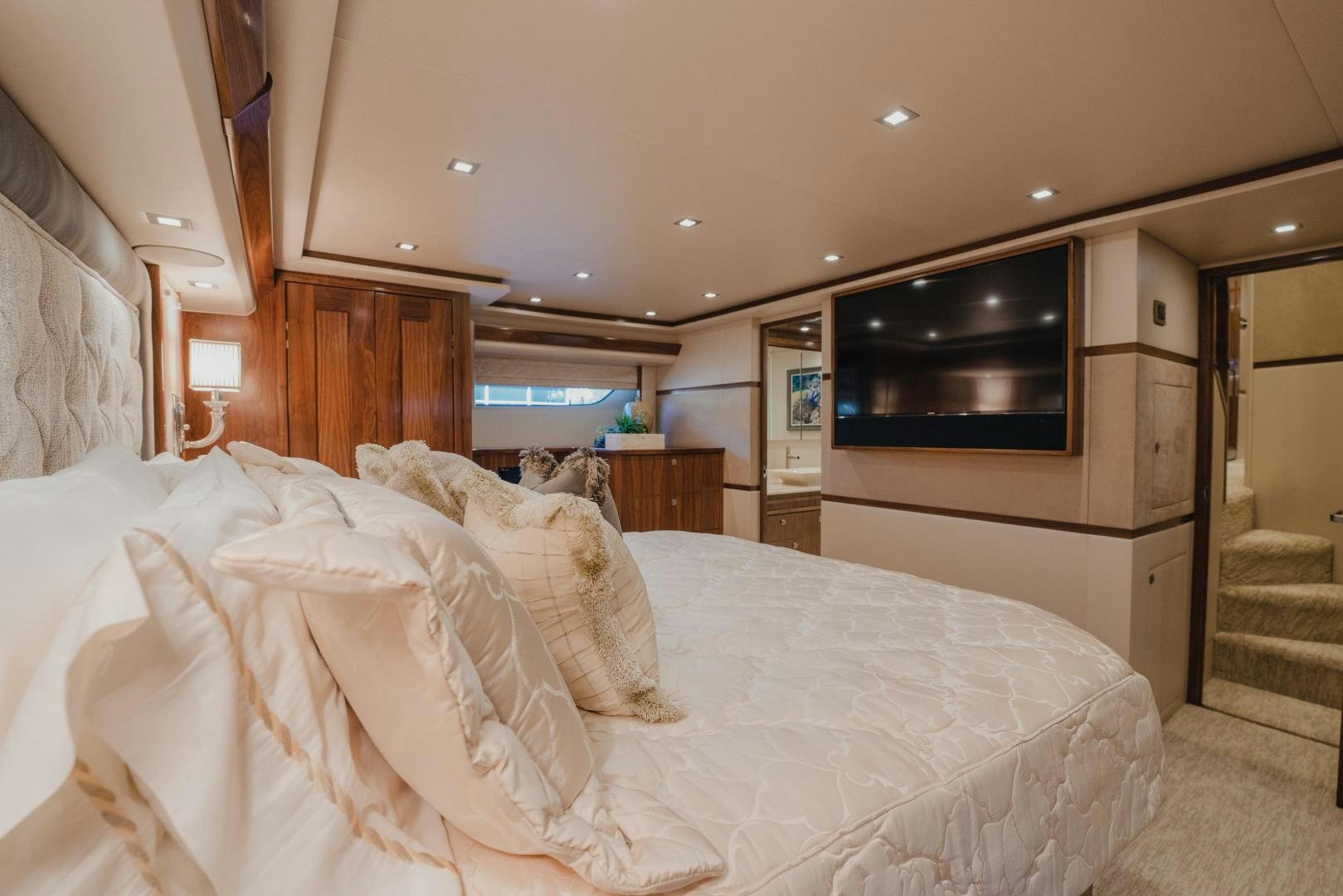 a bedroom with a bed and a television aboard AUSPICIOUS Yacht for Sale