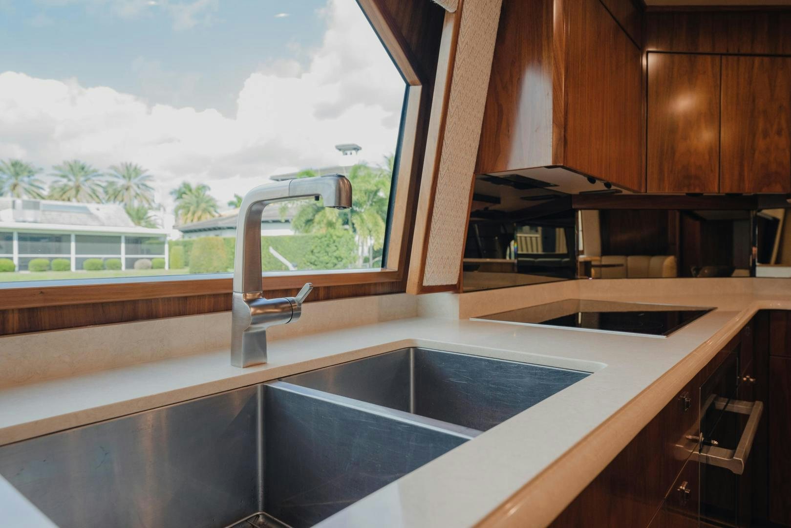 a kitchen with a large window aboard AUSPICIOUS Yacht for Sale