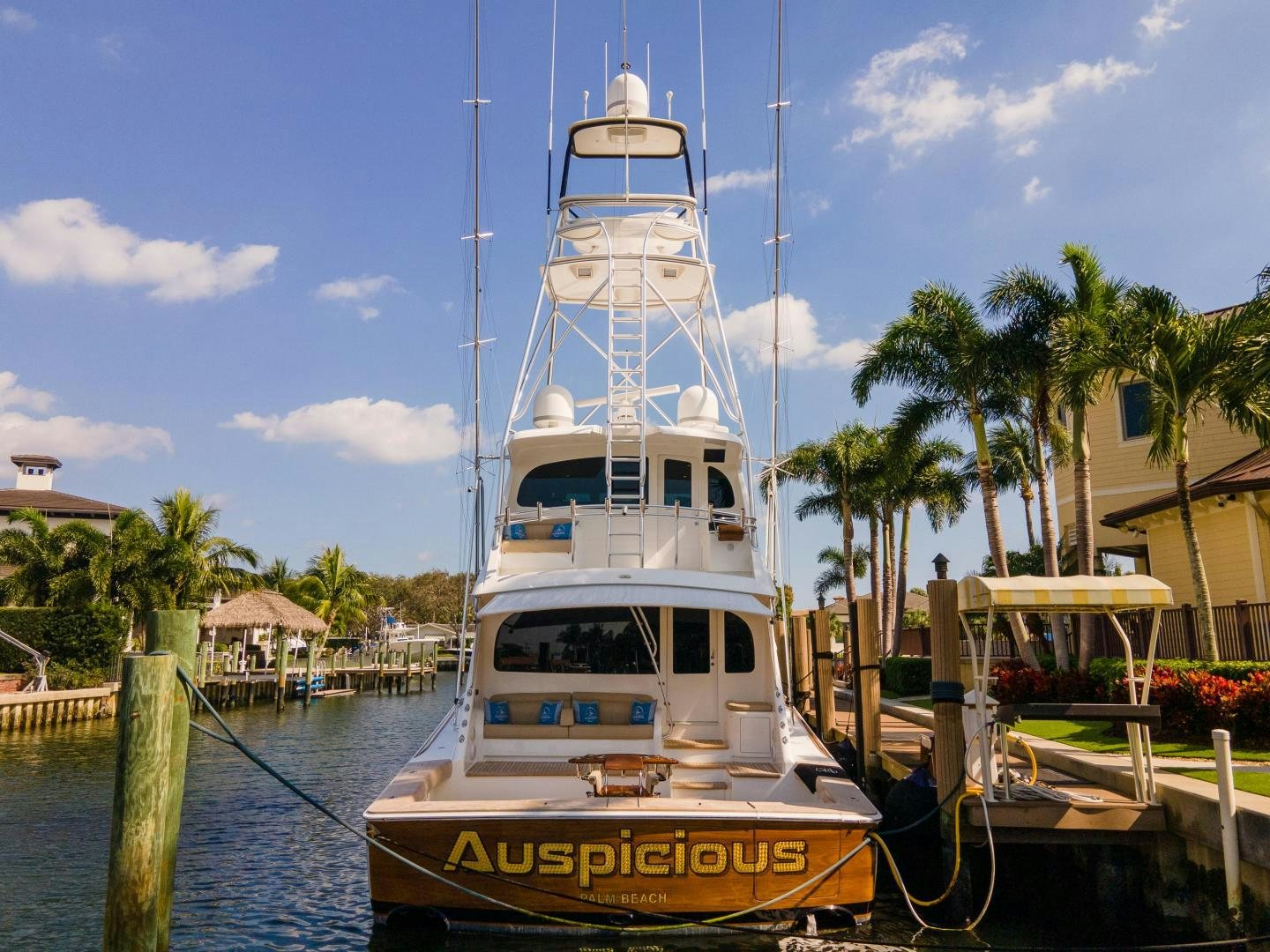 a boat docked at a pier aboard AUSPICIOUS Yacht for Sale