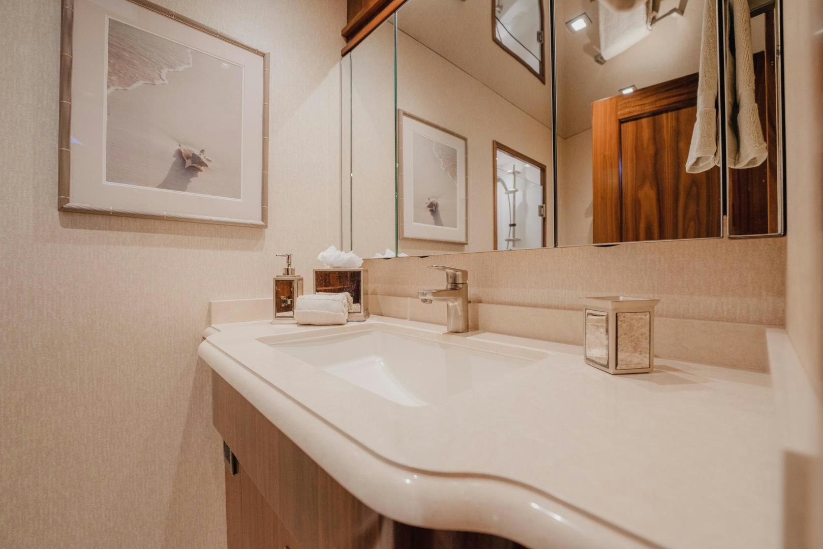 a bathroom with a large mirror aboard AUSPICIOUS Yacht for Sale