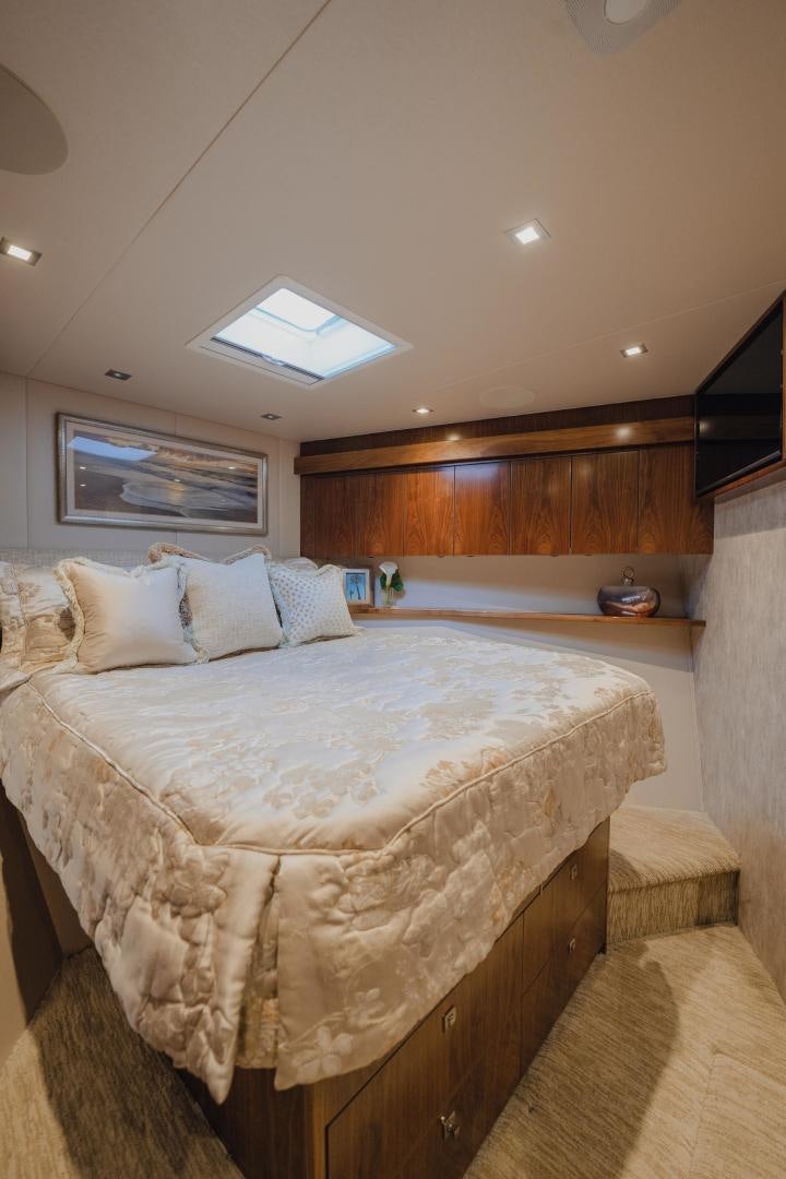 a bedroom with a large bed aboard AUSPICIOUS Yacht for Sale