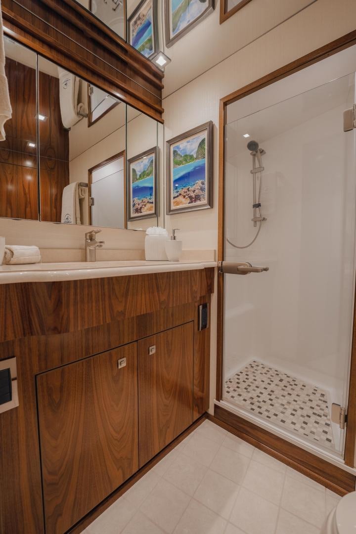 a bathroom with a large mirror aboard AUSPICIOUS Yacht for Sale